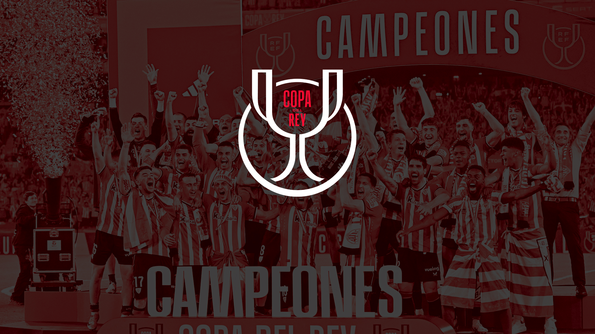 Copa del Rey champions celebrating beneath the competition trophy emblem